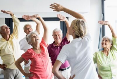 Seniors doing exercises in a retirement home